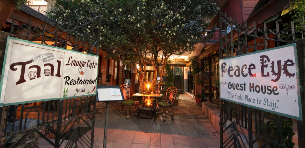 The warmly lit entrance to Peace Eye Guest House