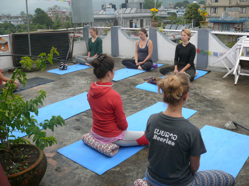 Morning rooftop yoga at Peace Eye Guest House